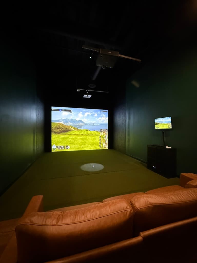 Wide view of a TrackMan bay mid-swing