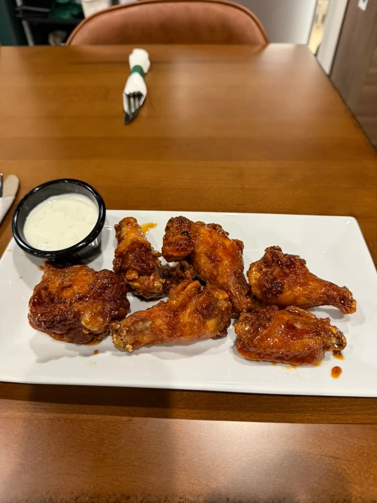 Crispy wings tossed and ready to share
